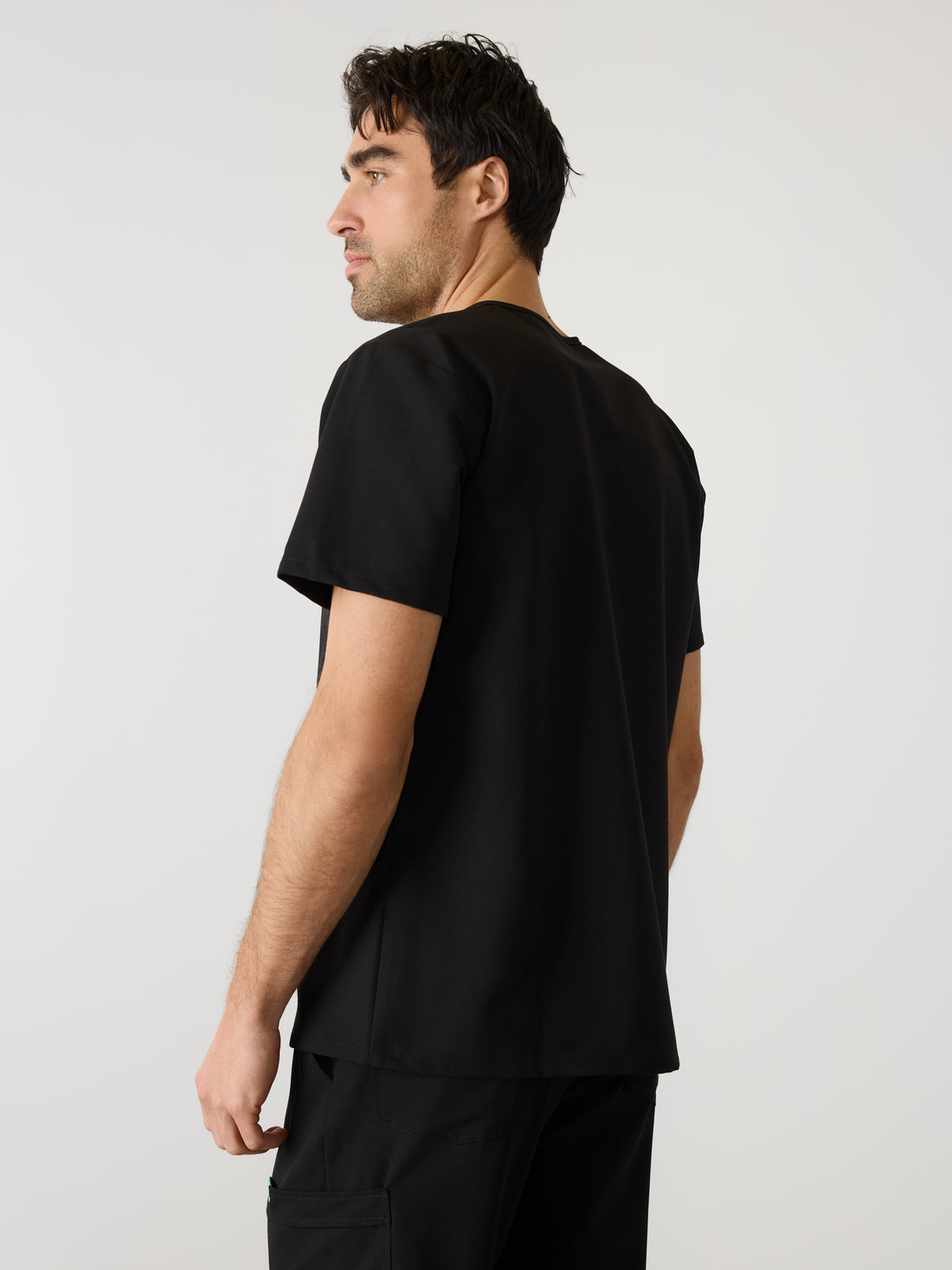LOGAN With King Animal Hospital EMBROIDERY - BLACK - One Pocket Men's Scrub Top - SILVADUR™