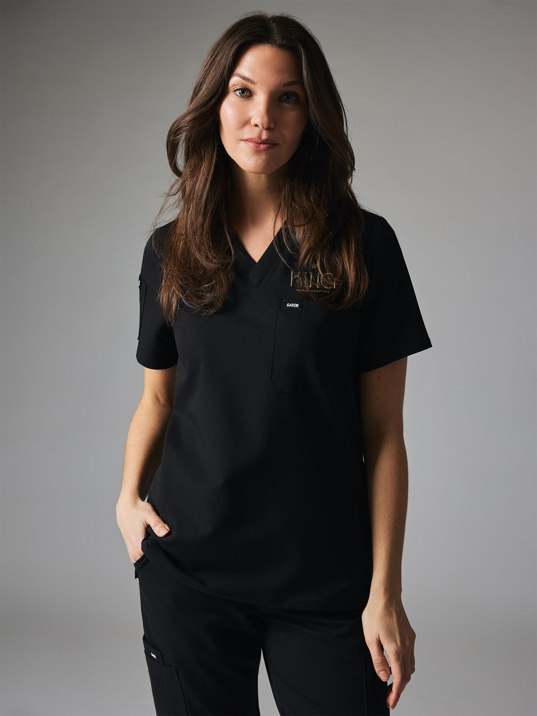 SOFIA With King Animal Hospital EMBROIDERY - BLACK - Six Pockets Scrub Top - SILVADUR™