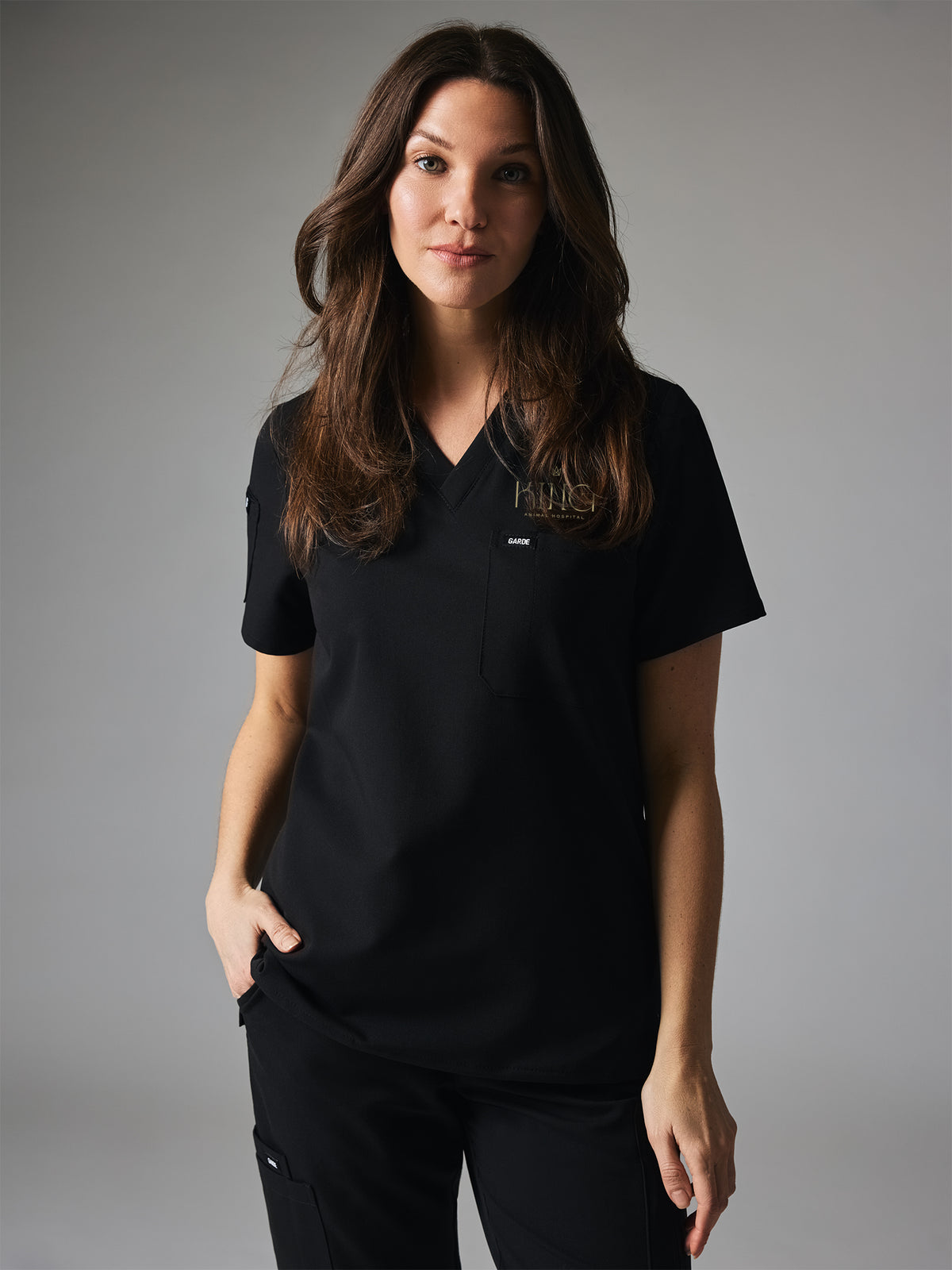 SOFIA With King Animal Hospital EMBROIDERY - BLACK - Six Pockets Scrub Top - SILVADUR™
